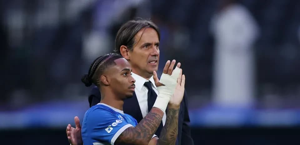 Player and coach interacting after match conclusion