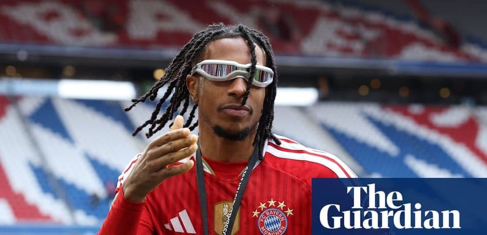 Player gesturing while wearing Bayern Munich jersey