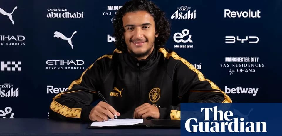 Player signing contract at Manchester City press conference