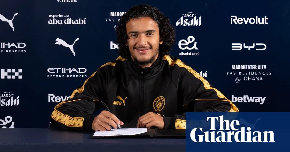 Player signing contract at Manchester City press conference
