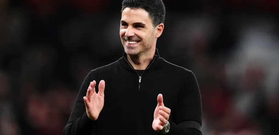 Manager clapping on the sideline during match