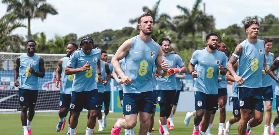 England team jogging during training session on pitch
