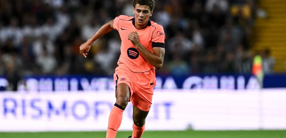 Player running in pink kit during match