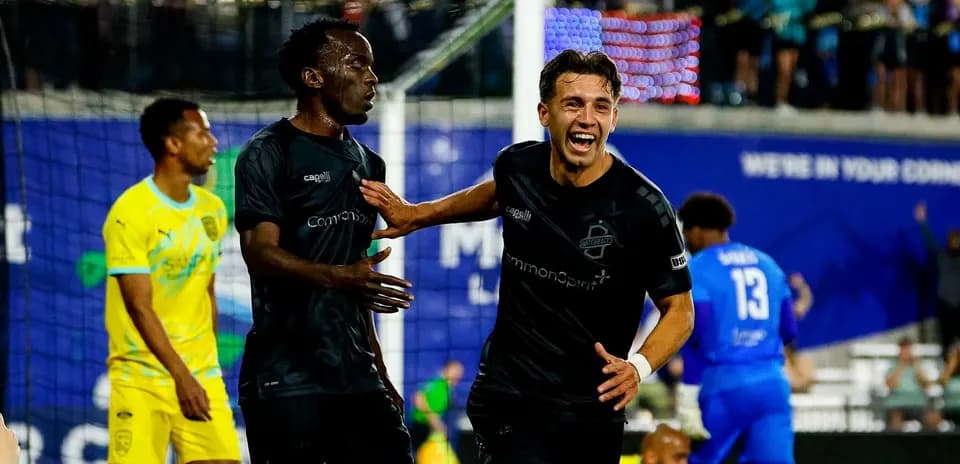 Players celebrating goal during FC Tulsa match