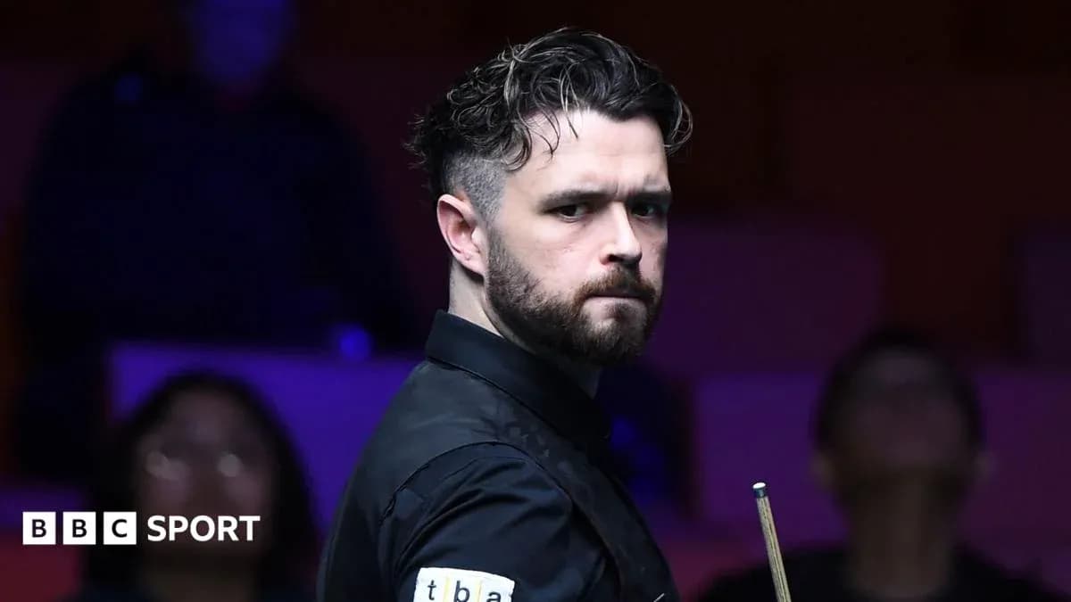 Snooker player preparing to take a shot