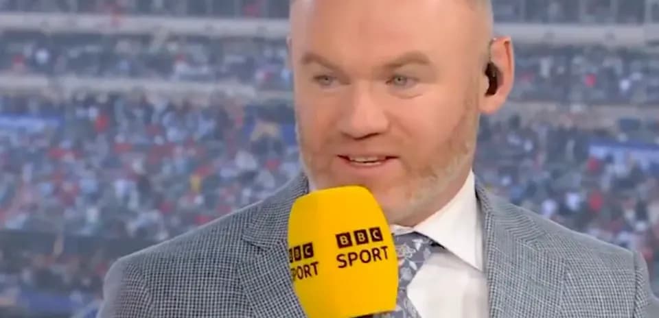 Sports commentator speaking with microphone in studio