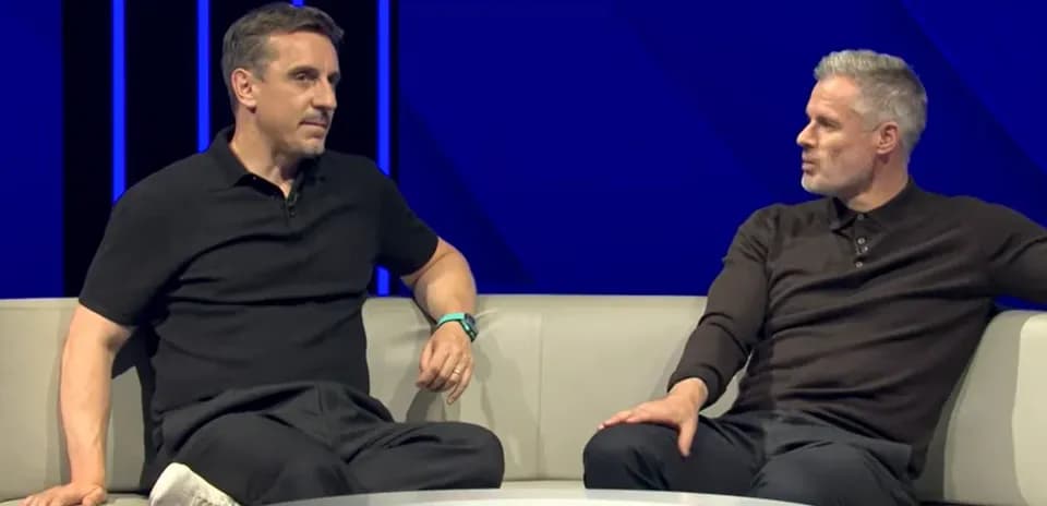 Two pundits discussing football on a sofa