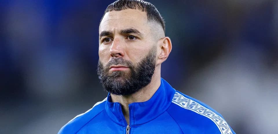 Player in blue tracksuit during match preparation