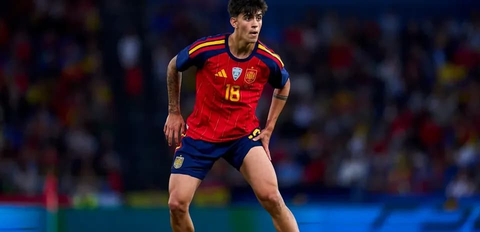Player in Spain kit during football match action