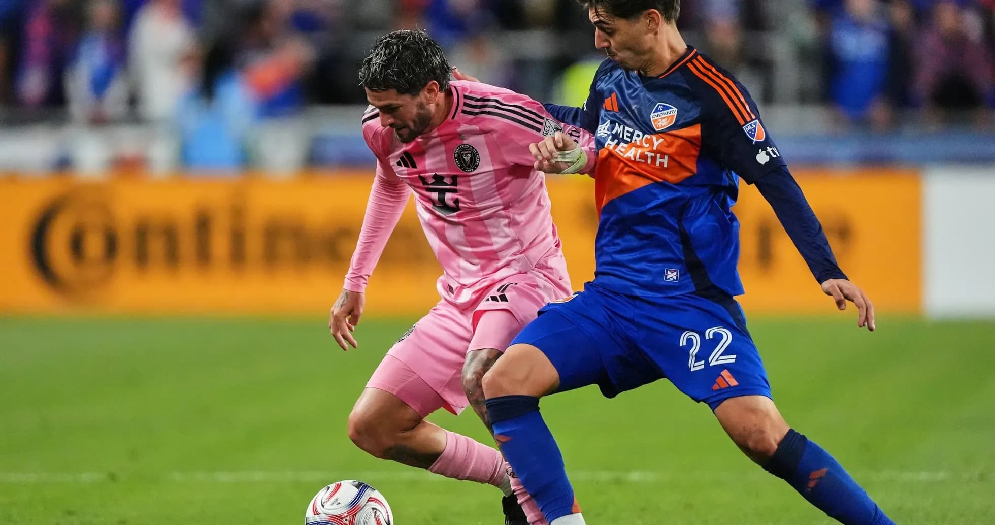 Players battling for the ball during match