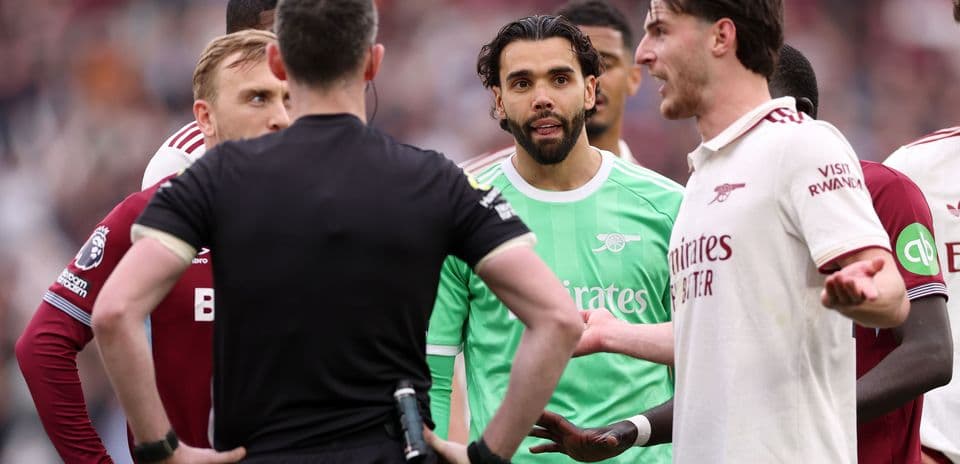 Players discussing with referee during match confrontation