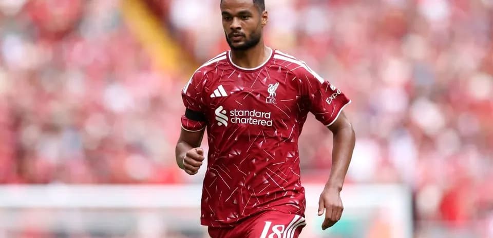 Player in Liverpool kit running on the pitch