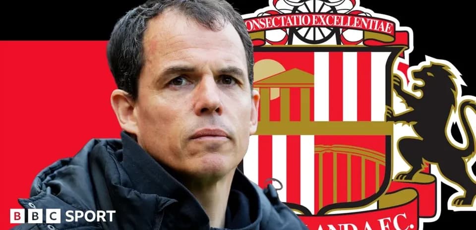 Manager in front of Sunderland AFC logo background