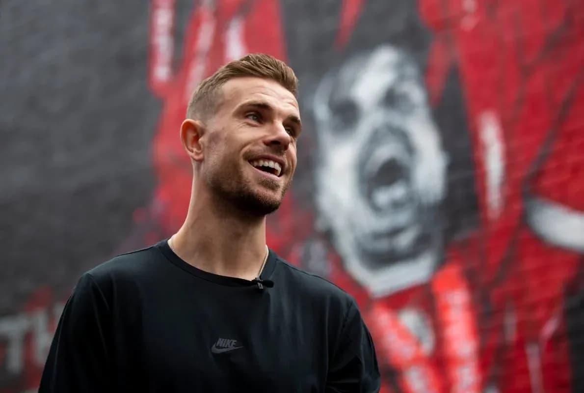 Player smiling in front of mural background