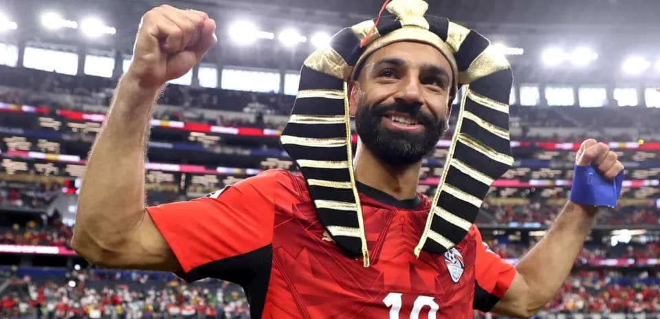 Player celebrating in a Pharaoh headdress after match