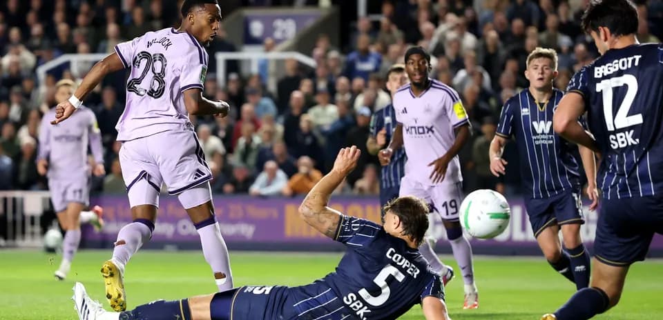 Player attempting to score while defender is down