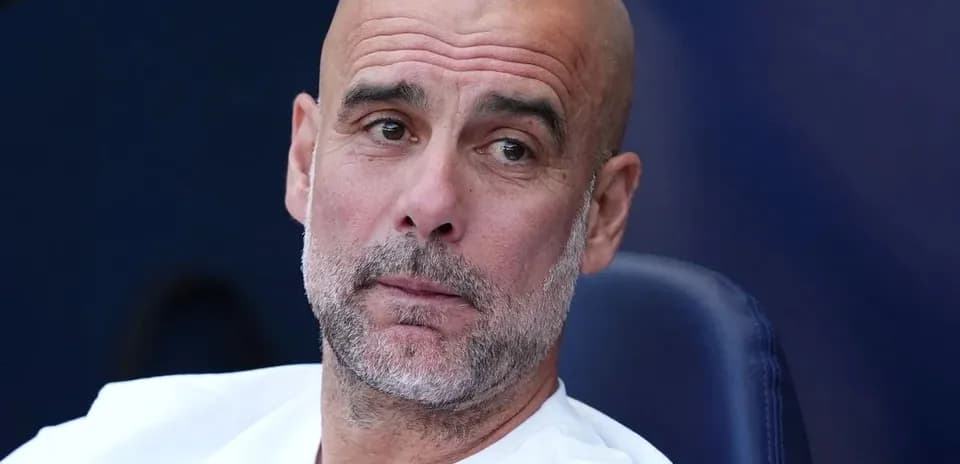 Coach sitting on bench during match