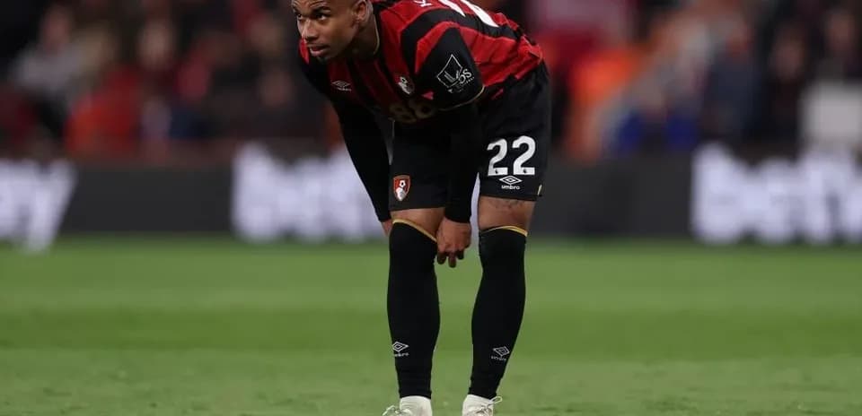 Bournemouth player bending forward on the pitch