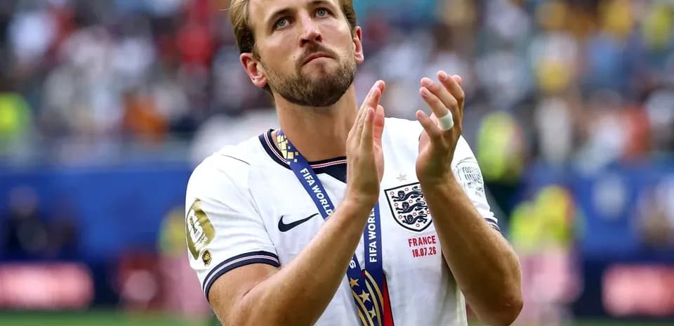 Player applauding while wearing a bronze medal