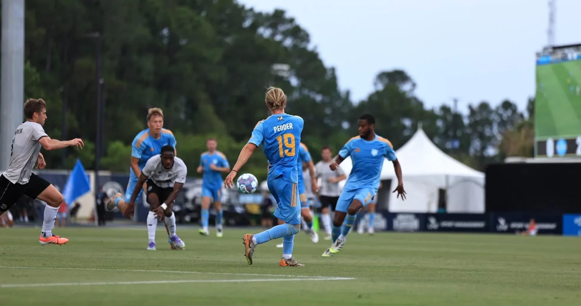 Player passing the ball during JAX vs Brooklyn match