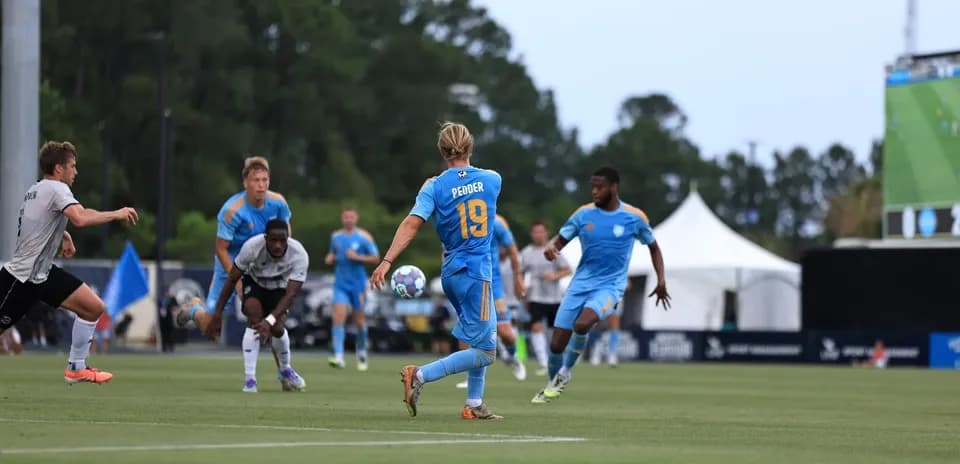 Player passing the ball during JAX vs Brooklyn match