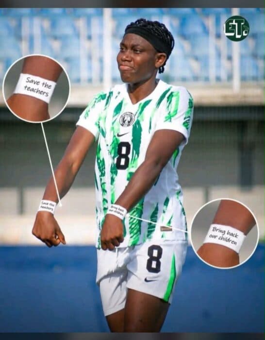 Player wearing jersey with messages on wristbands