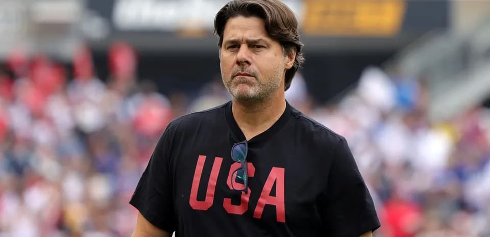 Coach wearing USA shirt during match day