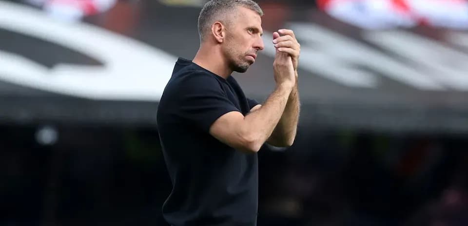Coach gesturing during a match from the sidelines