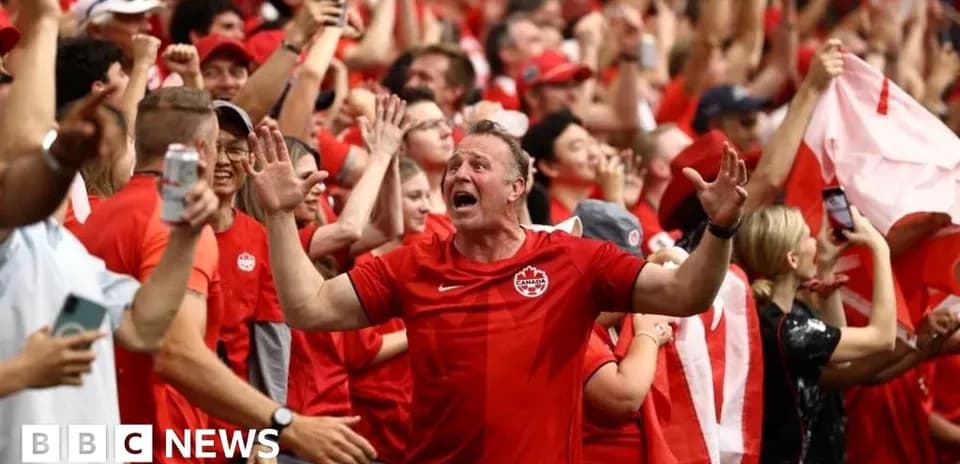 Fans celebrating in red during a sports event