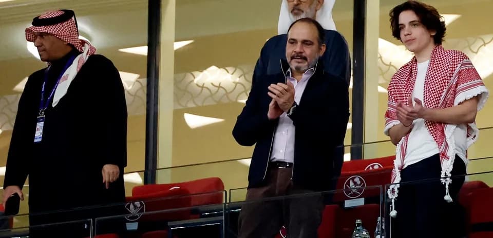 Spectators applauding in the stadium's VIP section