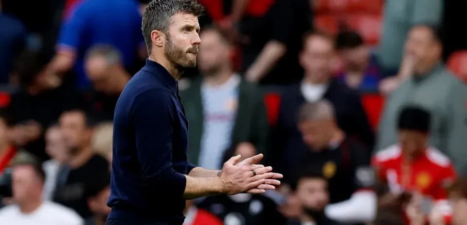 Coach clapping during match at Old Trafford