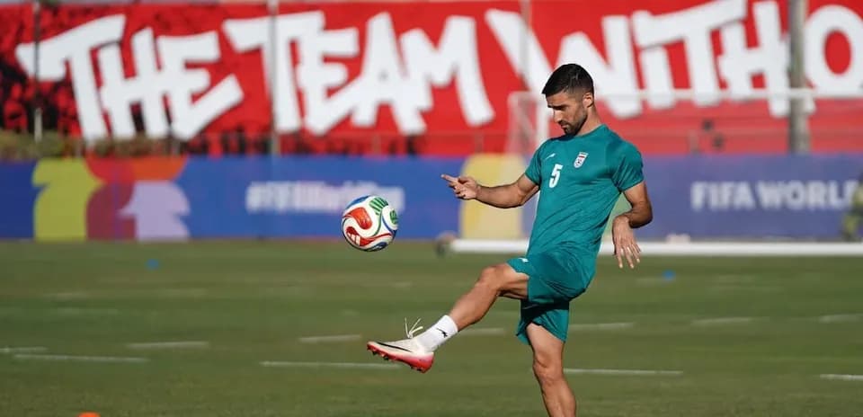 Iran player practicing with football before match