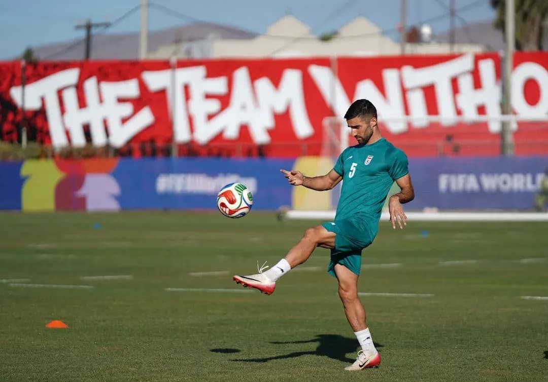 Iran player practicing with football before match