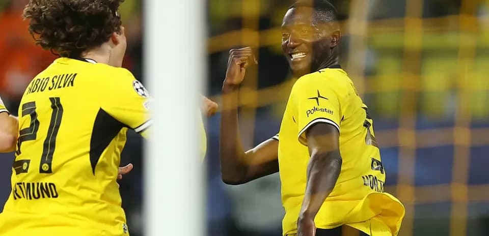 Players celebrating a goal during a match