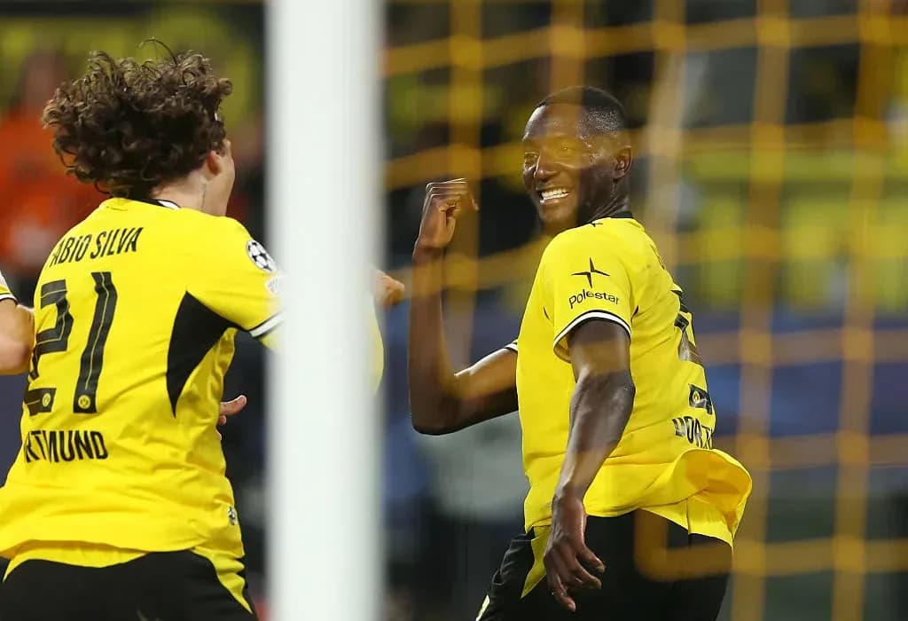 Players celebrating a goal during a match
