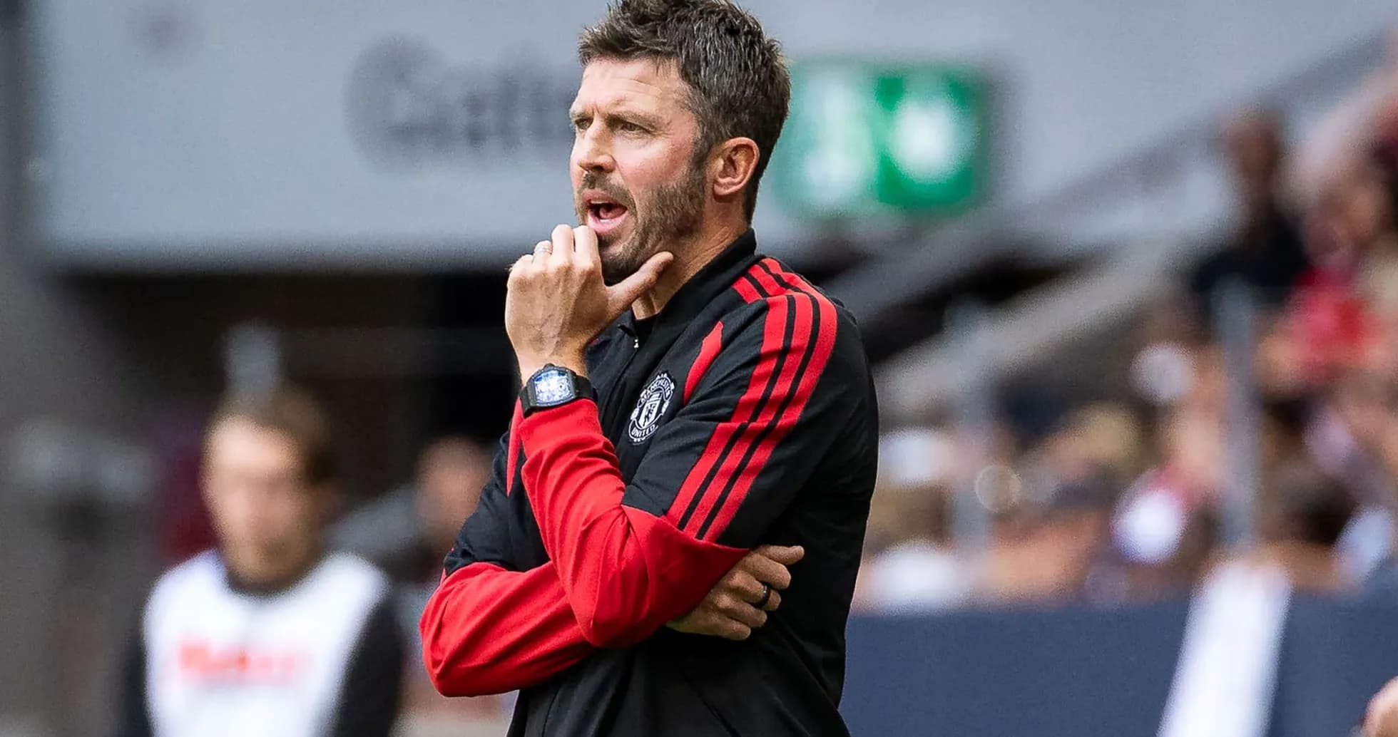 Coach giving instructions during match on sidelines