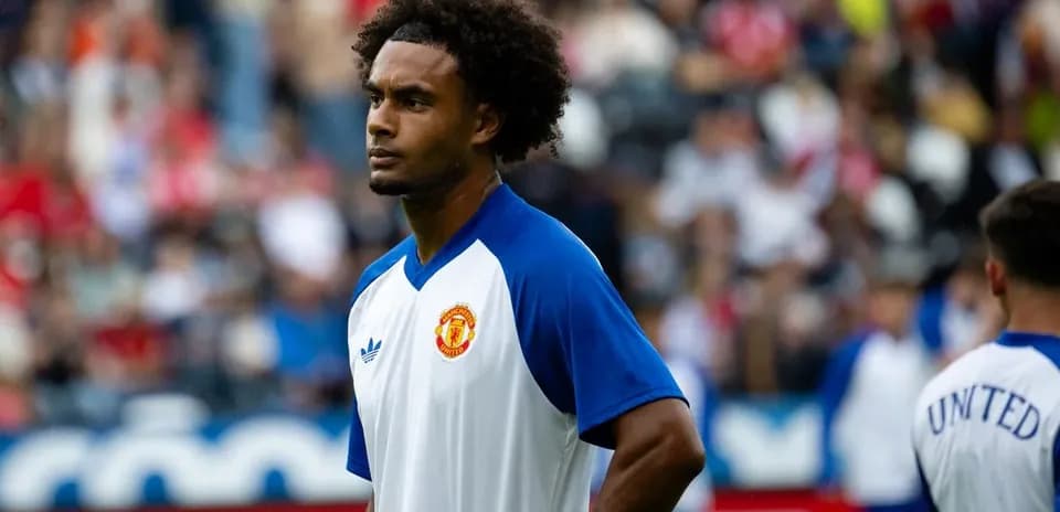 Player in Manchester United training kit on pitch