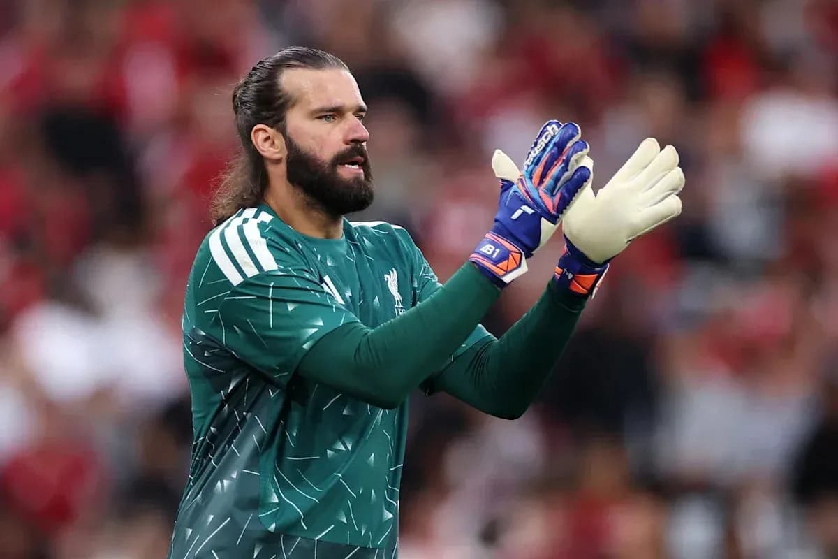 Goalkeeper clapping during a match in green kit