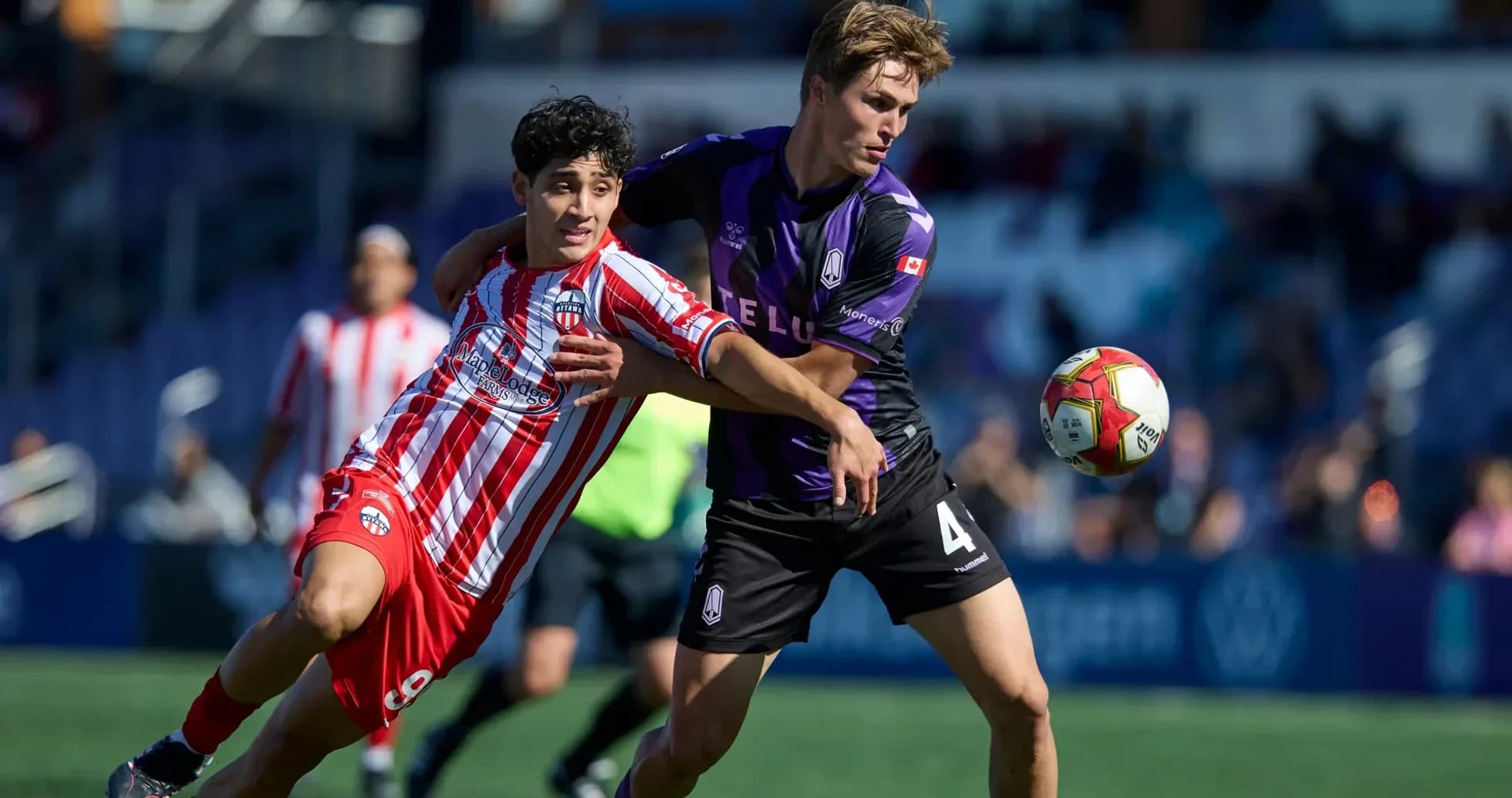 Players competing for the ball during match
