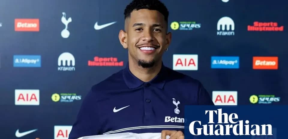 Player holding Tottenham Hotspur jersey at announcement