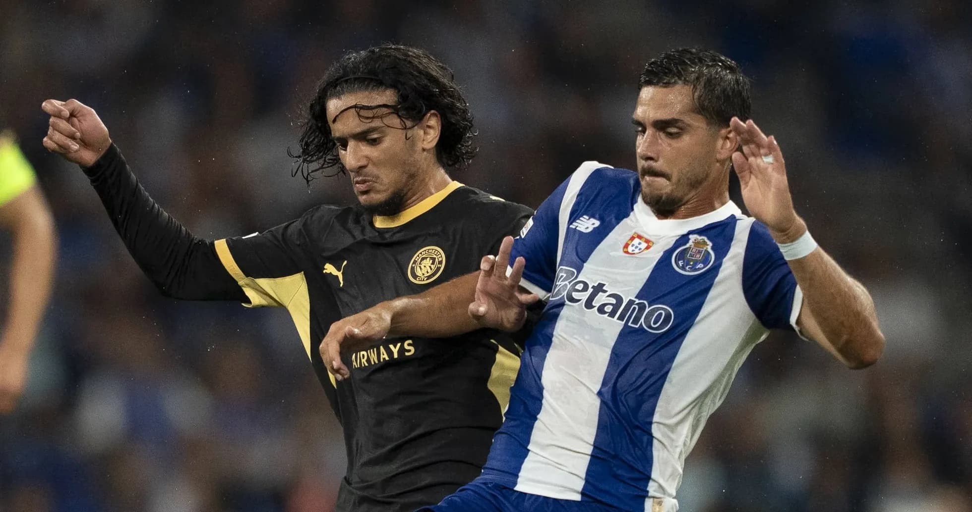 Two players competing for the ball during match