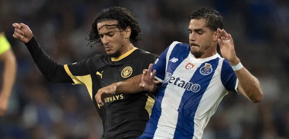 Two players competing for the ball during match