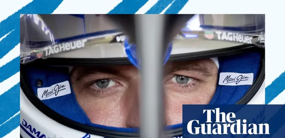 Close-up of a driver wearing a racing helmet