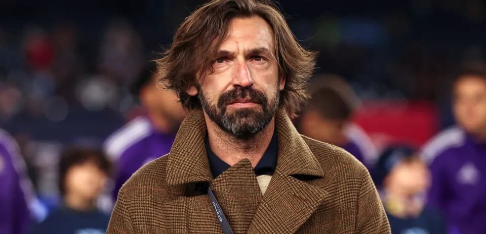 Man in brown coat at sports event