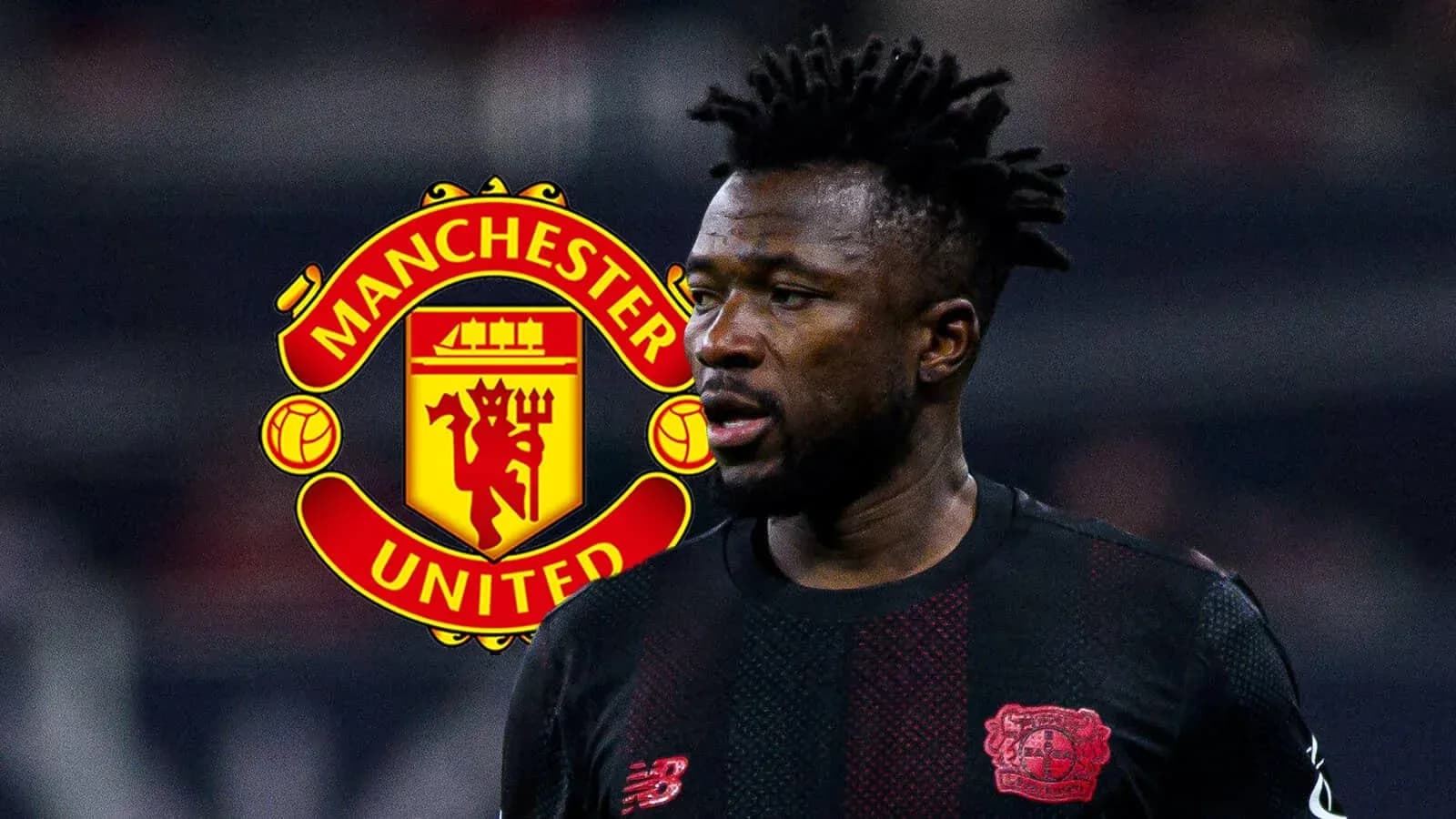 Player in black kit with Manchester United logo behind