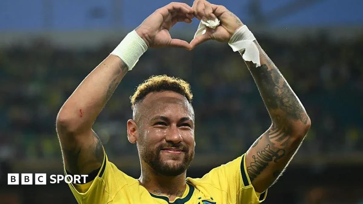 Neymar celebrating by making a heart shape