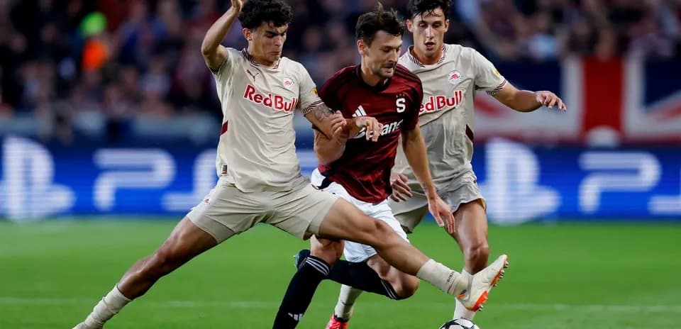 Players contesting the ball during Europa League match