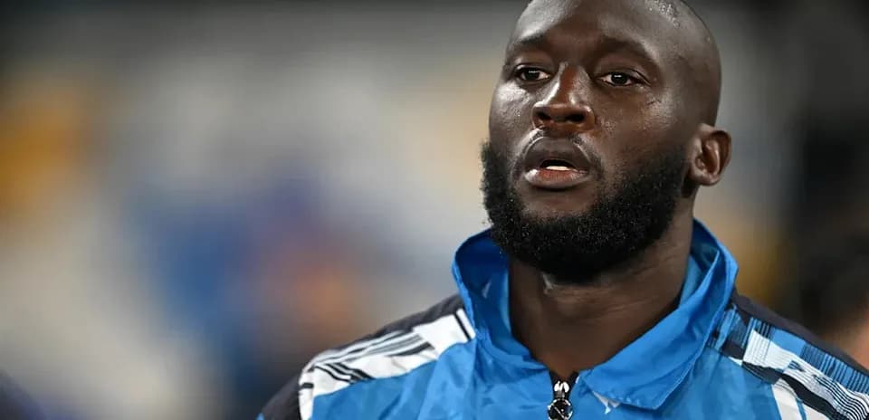 Player in blue Napoli jacket before the match