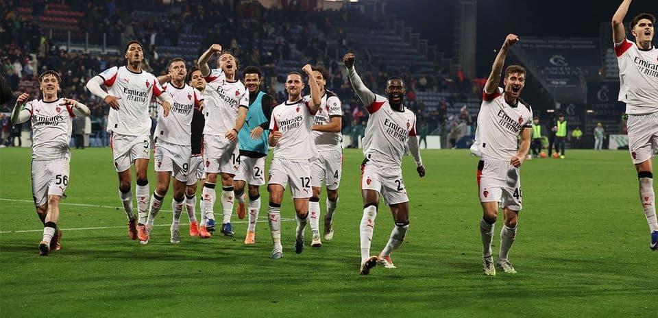 AC Milan players celebrating victory on the pitch