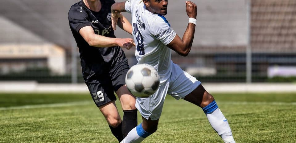 Player competing for the ball during Oberliga match